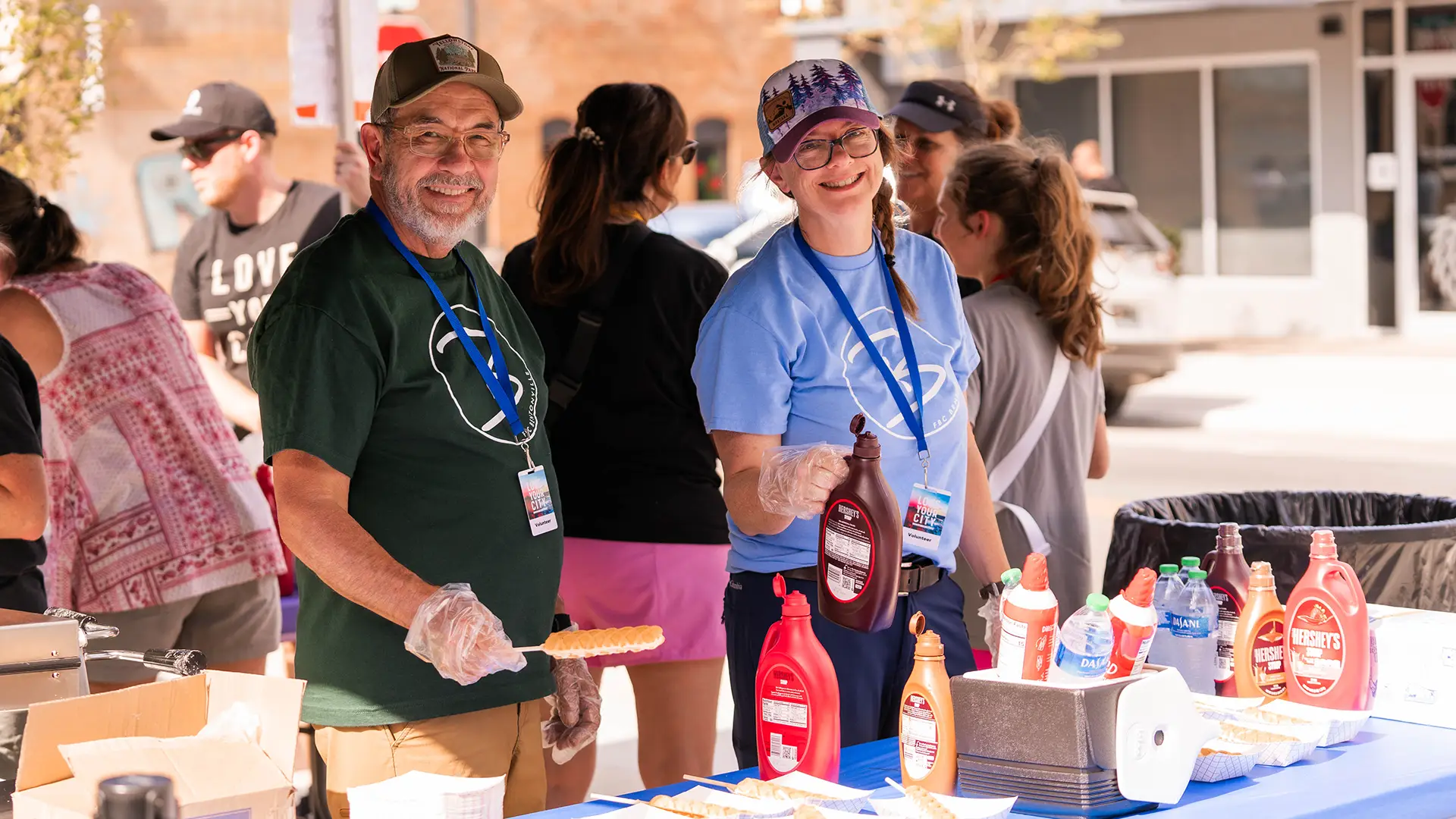 people serving desserts