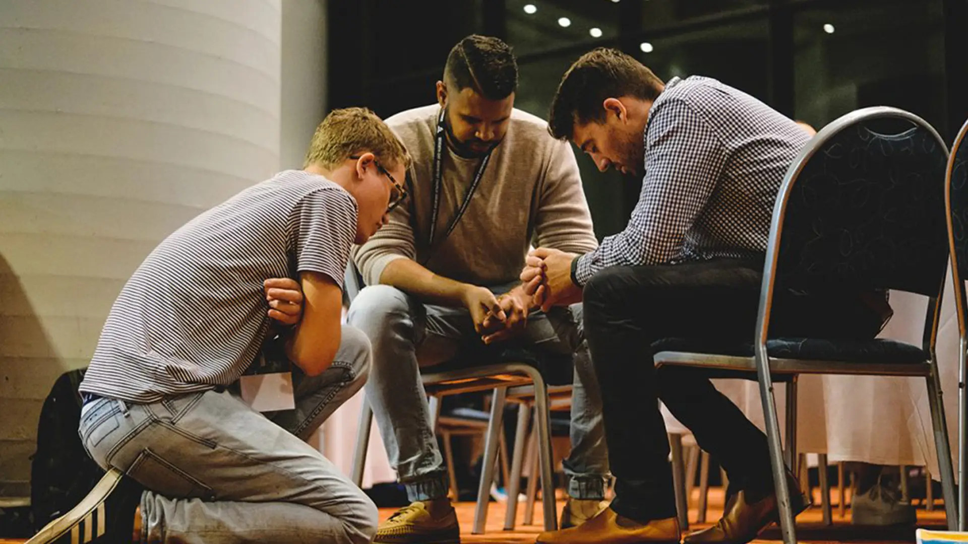 Men praying together
